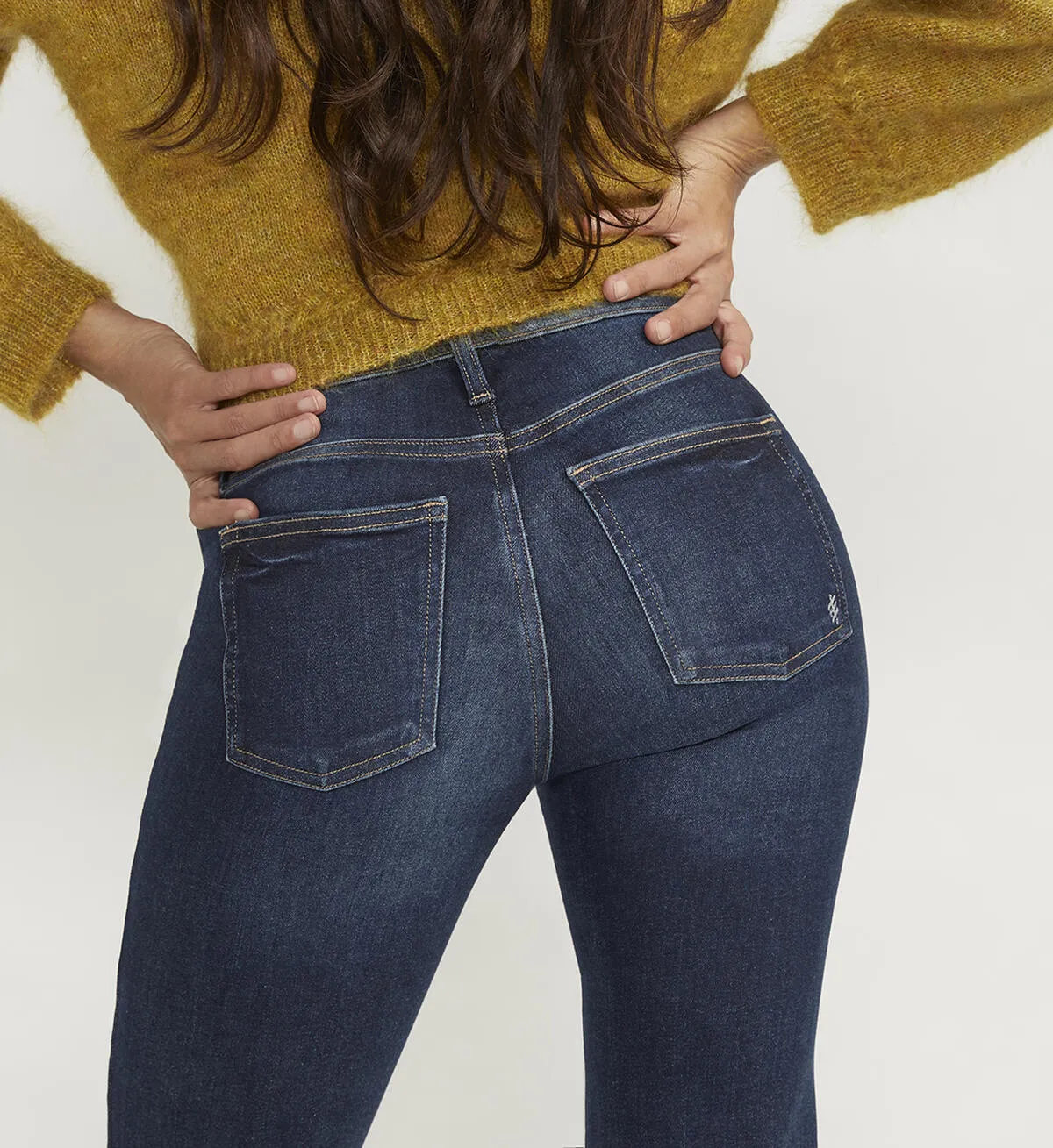 Infinite Fit Mid Rise Bootcut Jeans